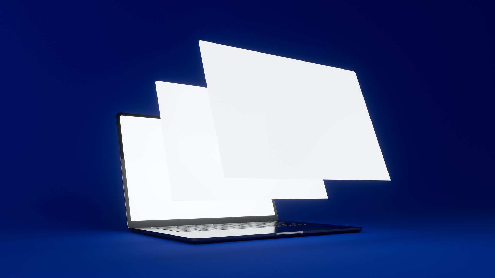 Laptop with floating screens showing website design
